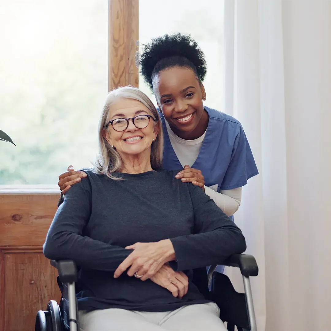 Nurse with senior women in wheelchair